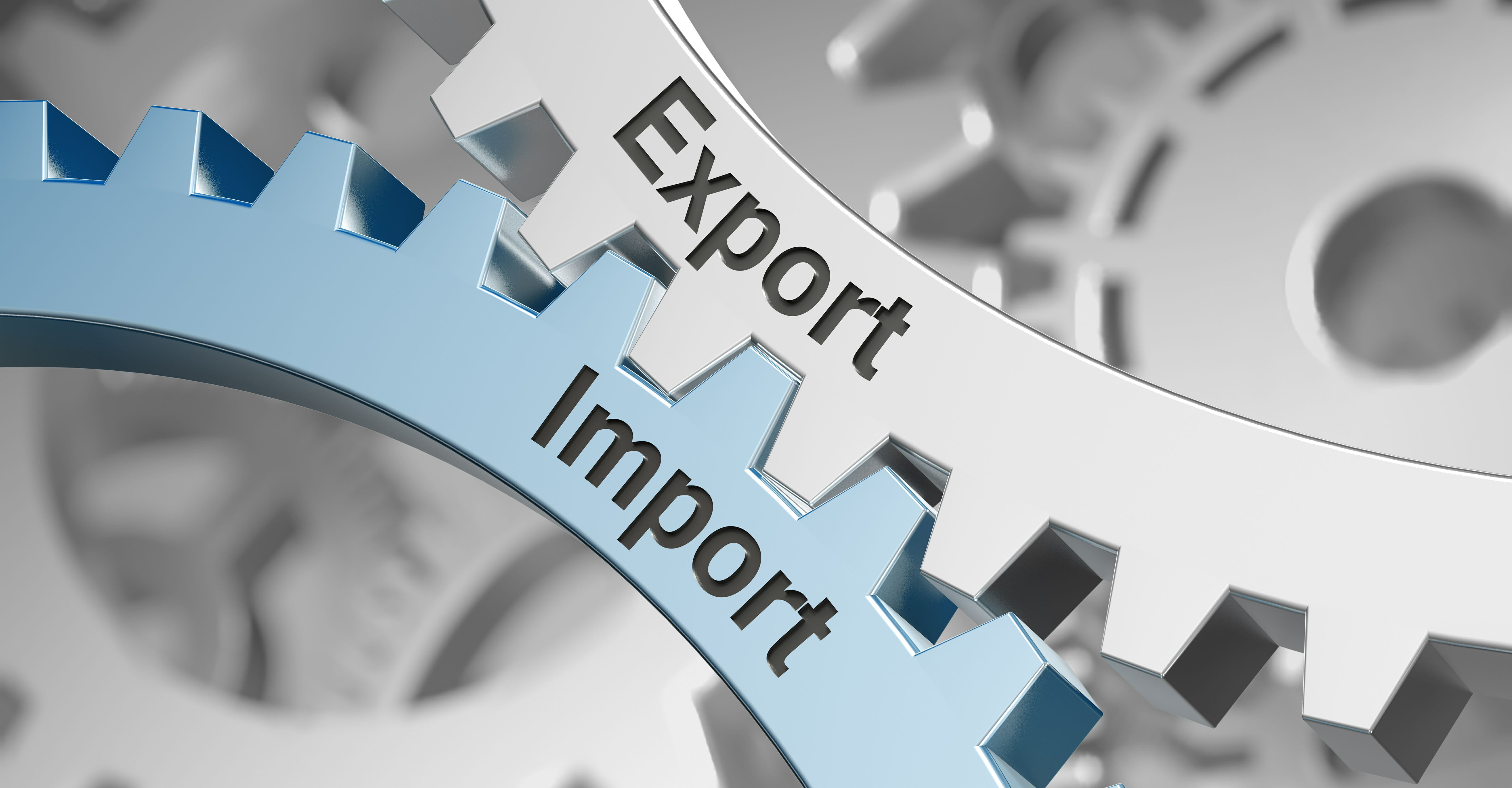 Ineinander greifende Zahnräder, auf denen Import und Export steht